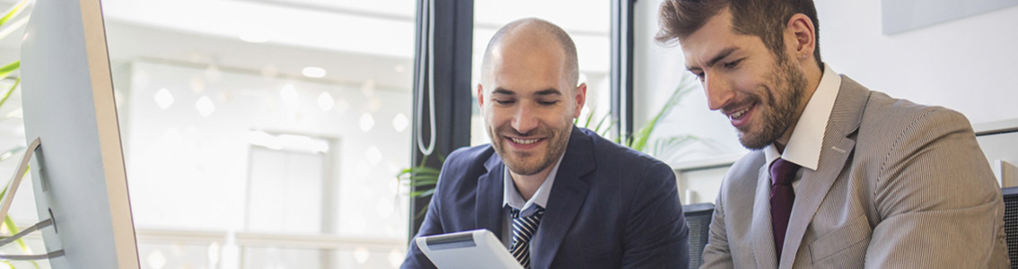 Businessmen looking at tablet